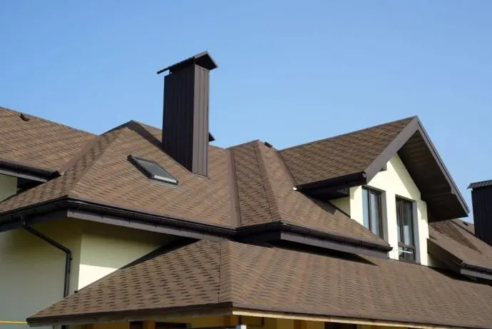 brown shingle roof on a newly built house