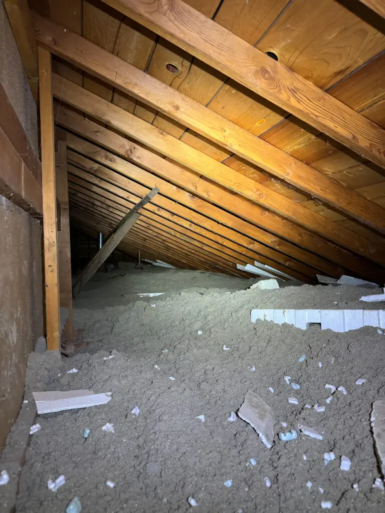 Dusty attic with wooden beams