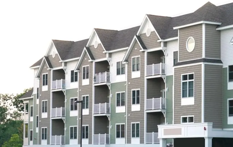 apartment complex with grey shingle roof
