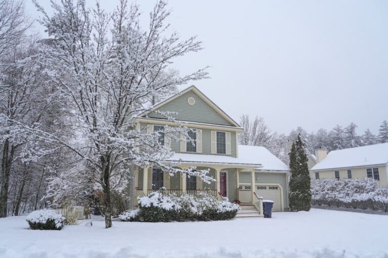 houses in residential community after snow in winter