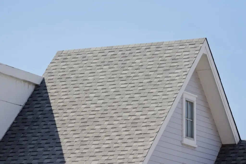 Roof shingles with garret house on top of the resident.