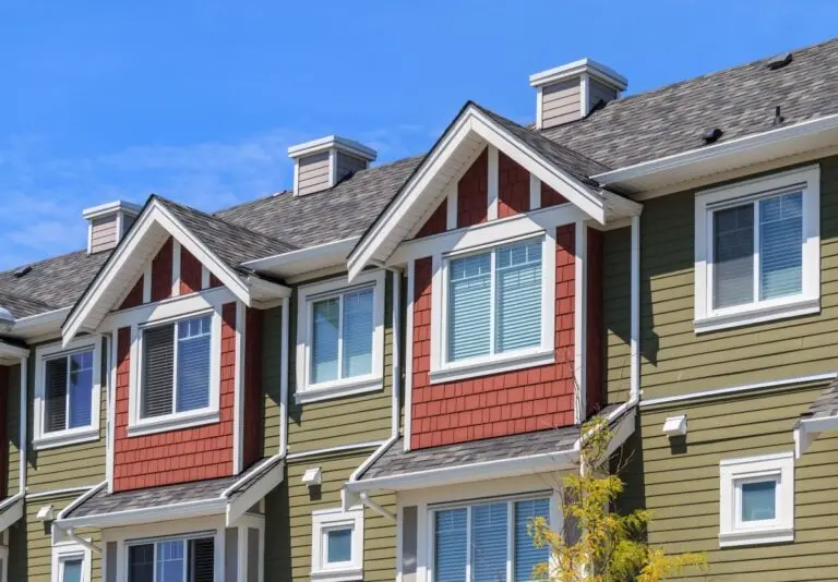 colorful apartment buildings with shingle roofs