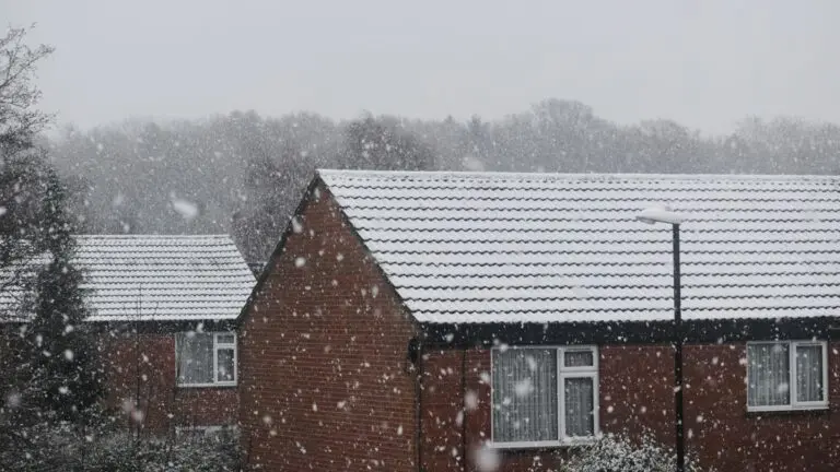 Old brick houses in snow on a winter morning