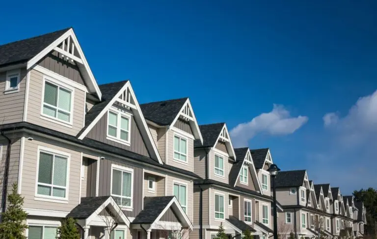 grey apartment buildings with shingle roofs