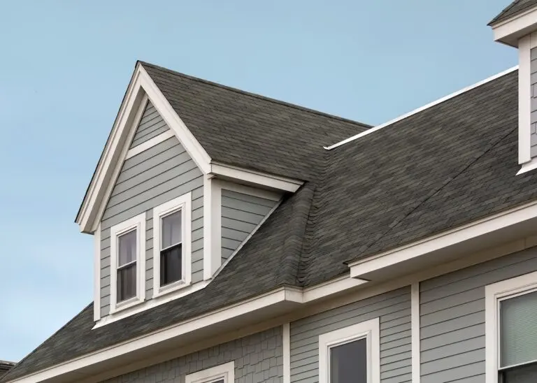 Roofing Mounds View Detailed view of a gable-style dormer window on a sloped roof of a newly built family house