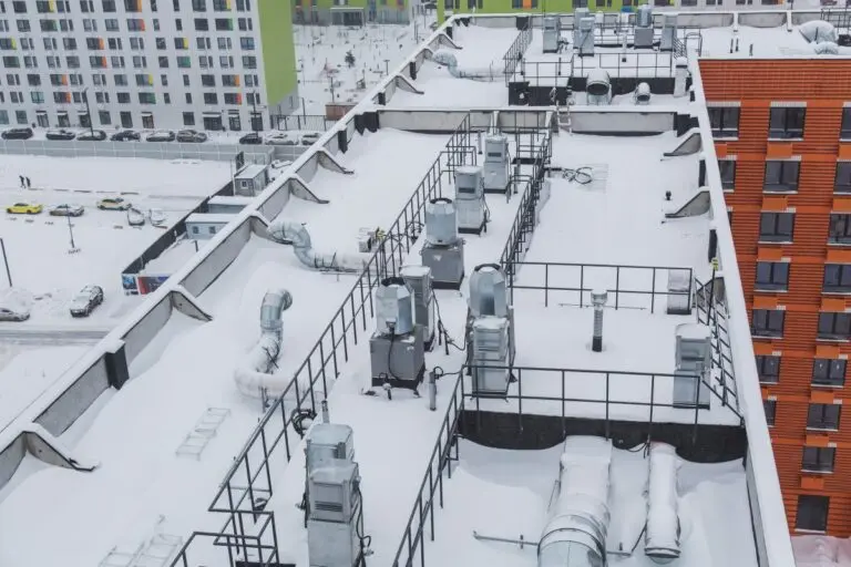 snow covered apartment roof