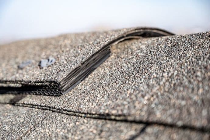 Typical residential ridge cap on a shingle roof apex
