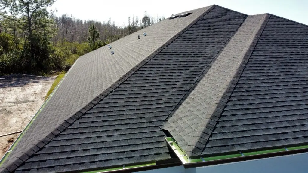 new development of houses roof construction from aerial drone