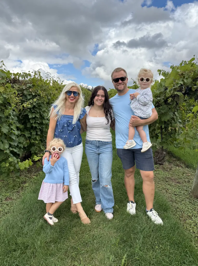 family photo of Noah and Anya and their three daughters who all live in Shoreview Minnesota and serve the local community as hail damage roofing contractors through owl roofing