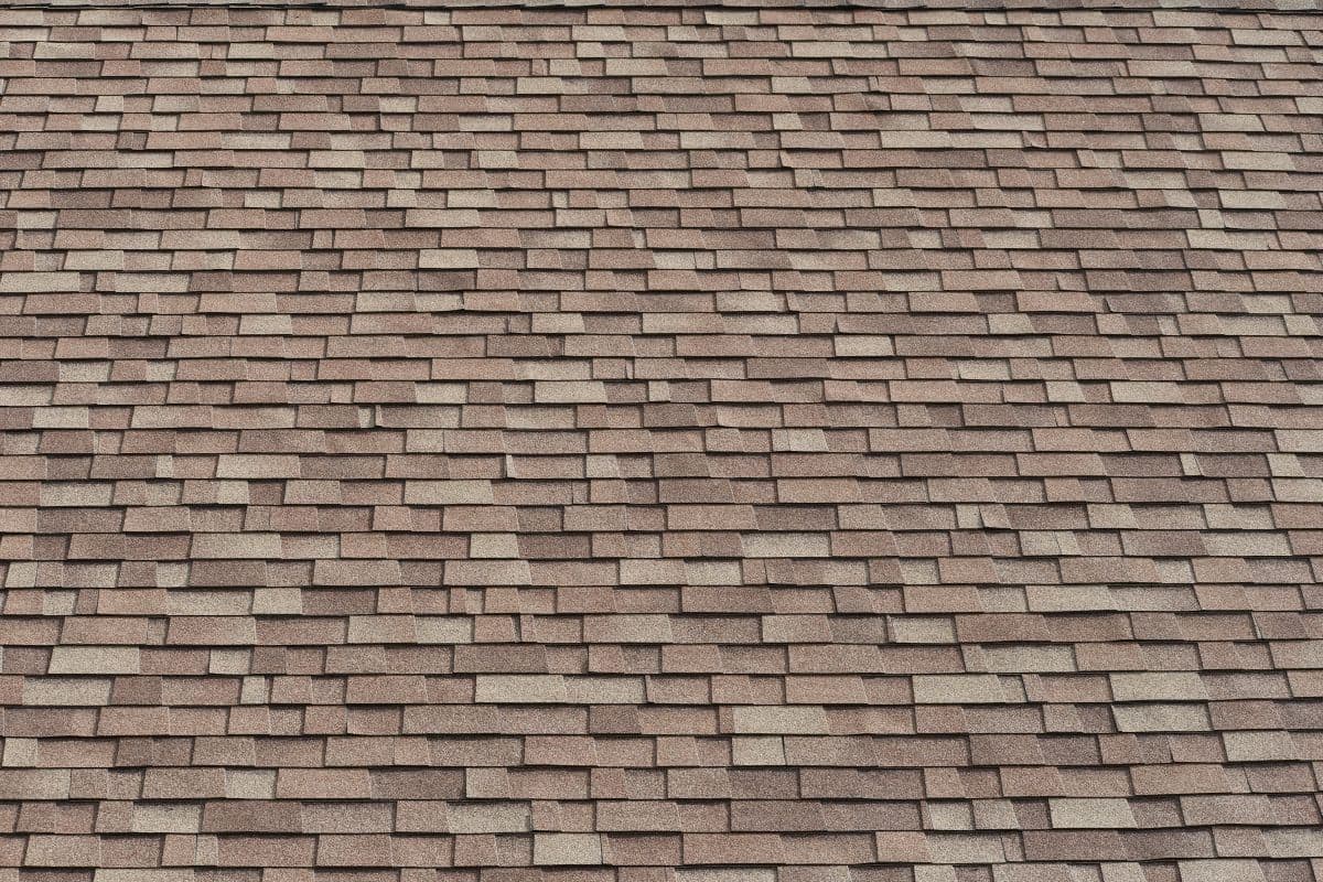 Shingled roof, high pitch. Three tab design.