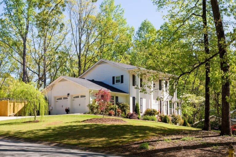 White Siding with Columns on hill