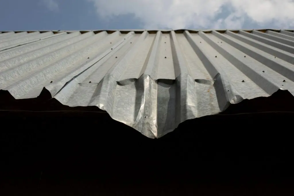 damaged metal roof after hail storm, North Oaks MN