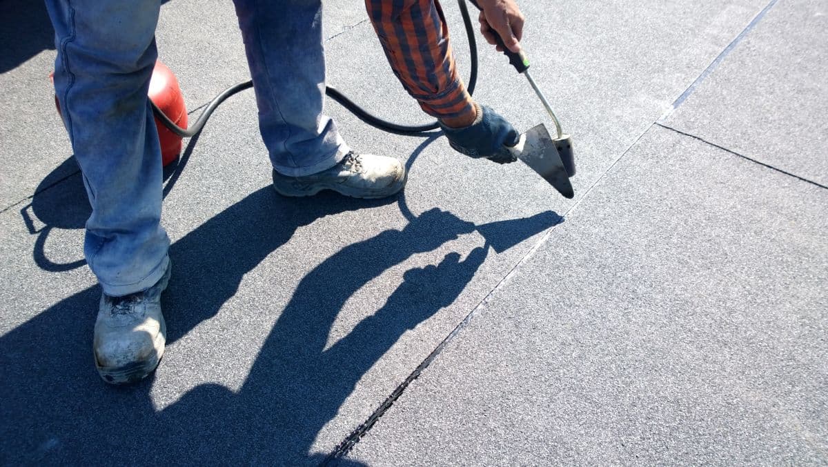 roofer repairing roof