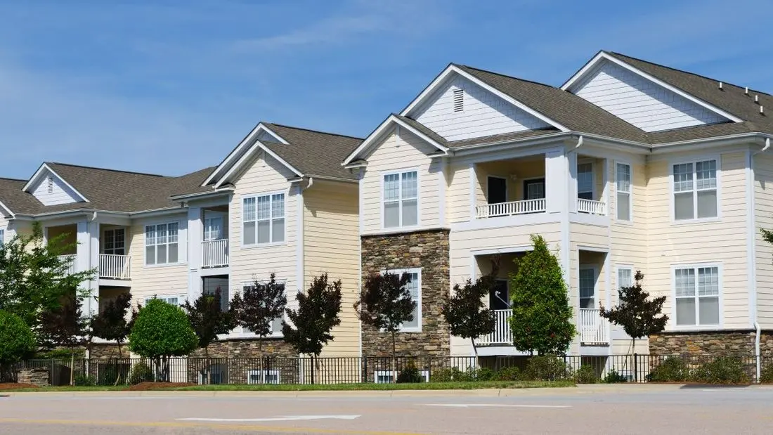 white apartments with shingle roofs