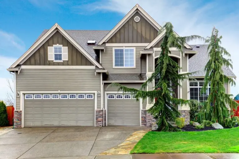 Roofing Forest Lake Beautiful olive siding house with tile roof, columns stoned at base, garage and green front trim