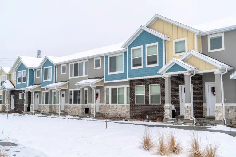 colorful apartments covered in snow