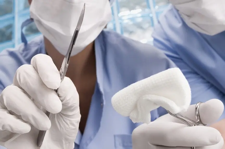 A doctor holding scissors