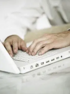 laptop with someone typing