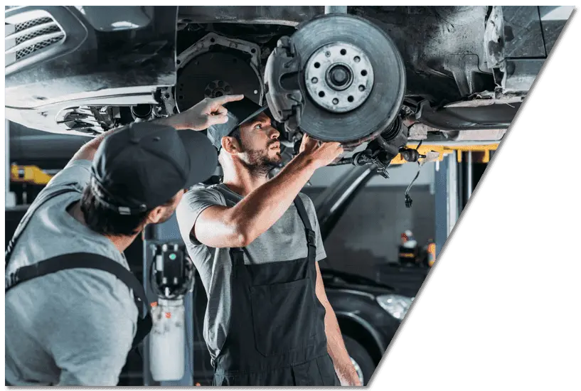 mechanics checking a car for repair