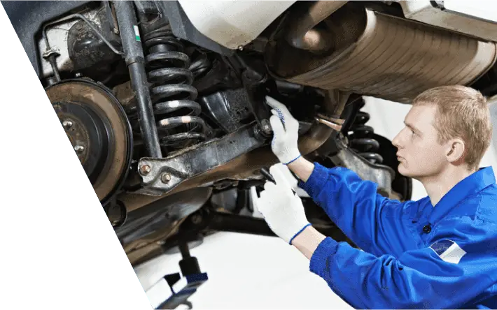 mechanic checking car suspension