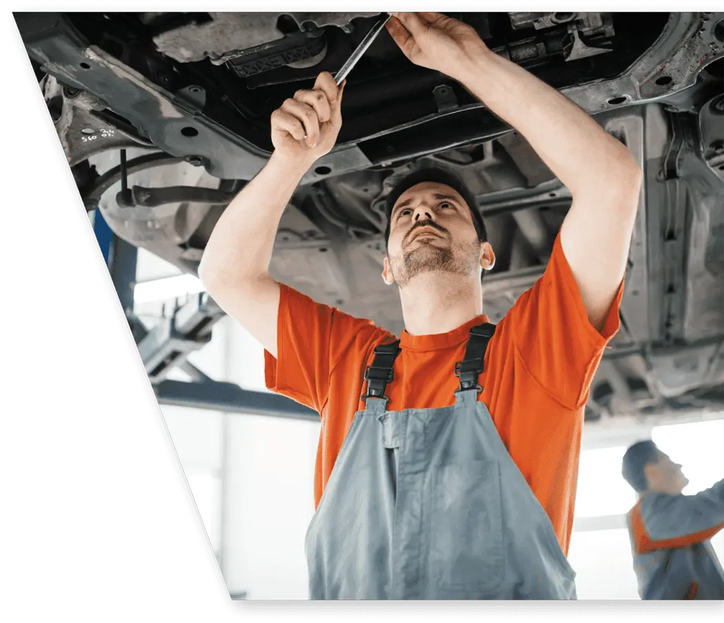 car mechanic fixing a car under