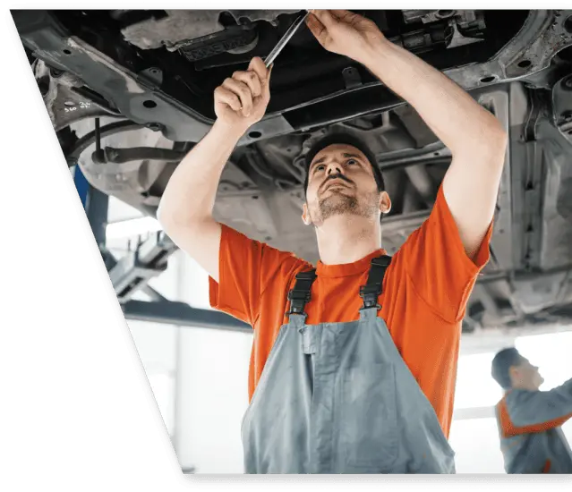 car mechanic fixing a car under