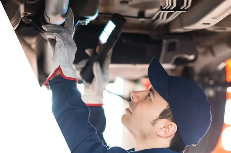car mechanic using checking a car for repair