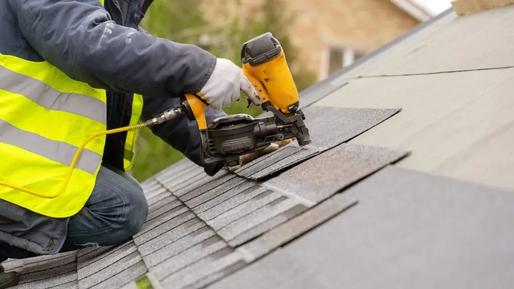 Installing roofing materials with nail gun