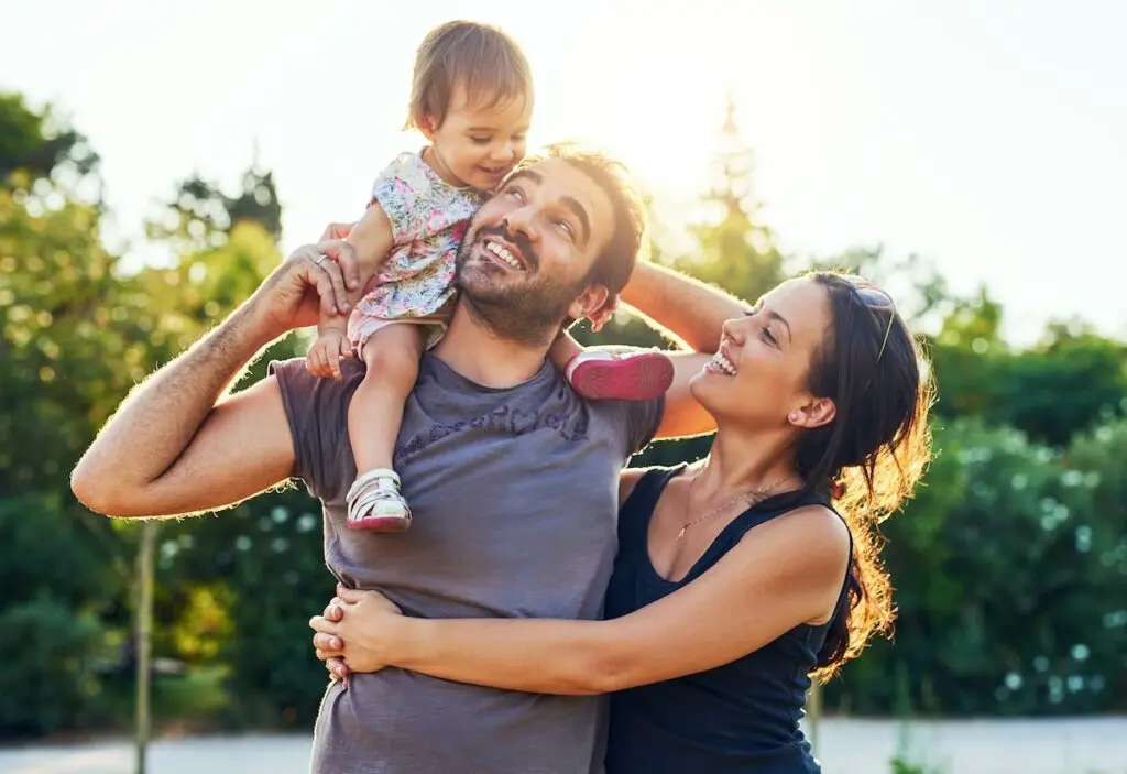 Shot of a young family outdoors.