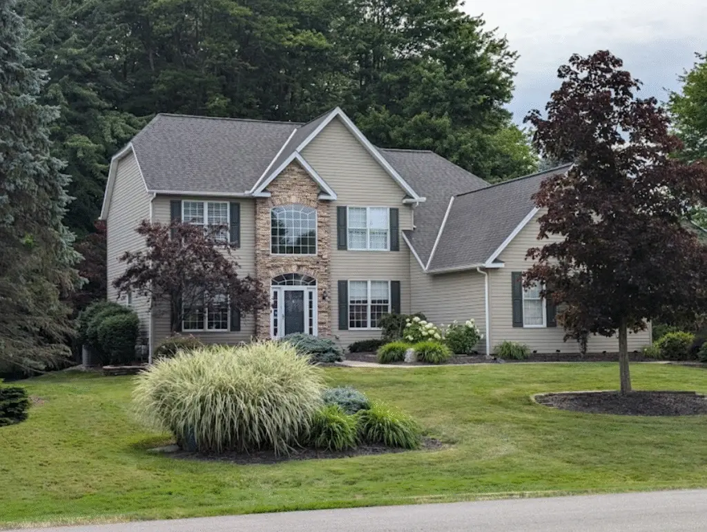 Tan gray house reroofed by Buckeye