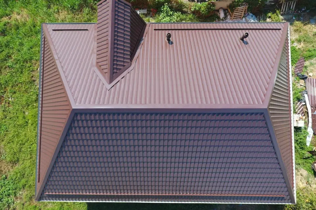 A view from above on the roof of the house. The roof of corrugated sheet. Roofing of metal profile wavy shape