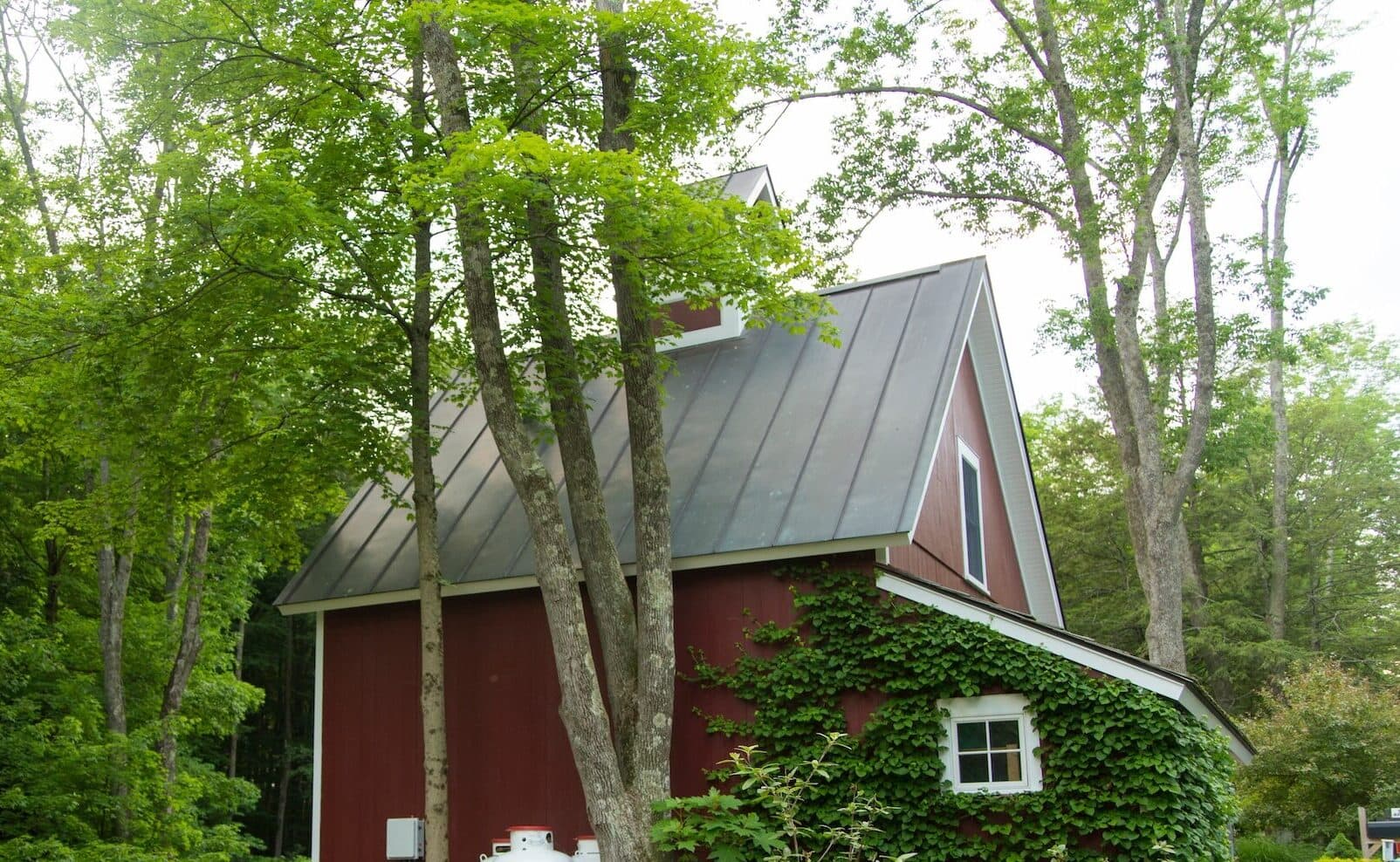 small red home metal roofing