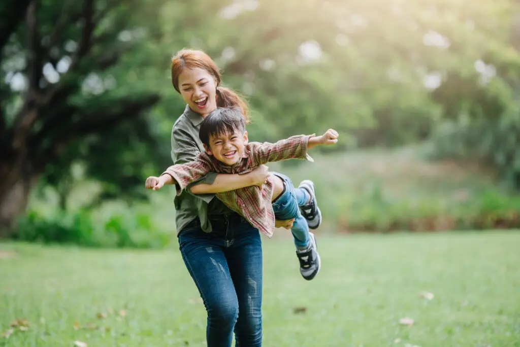 happy family playing outside in ohio