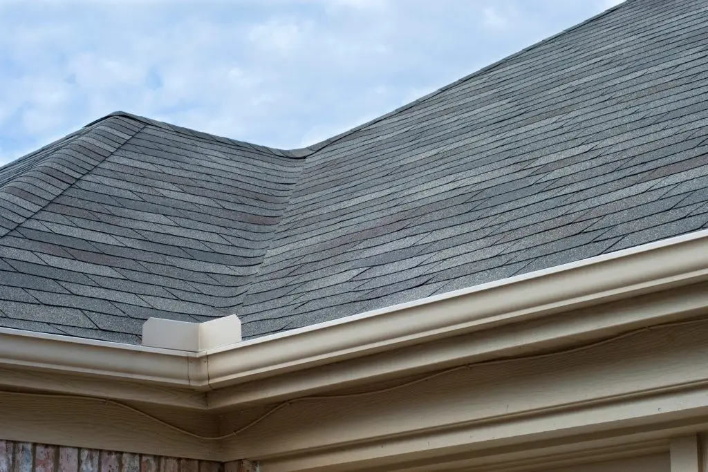 grey shingles roof with seamless gutter
