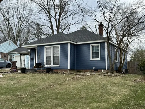 blue siding asphalt roof