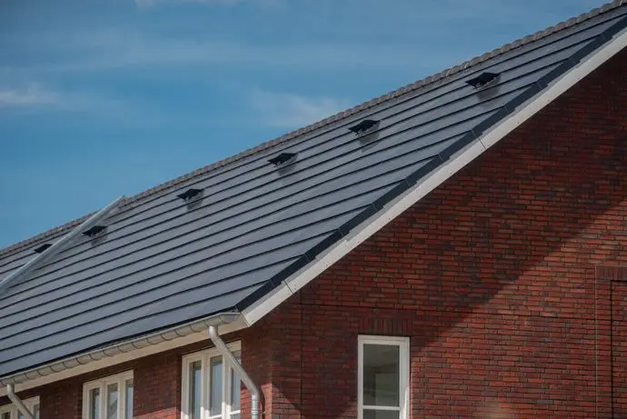 solar shingles vs solar panels big house brick wall