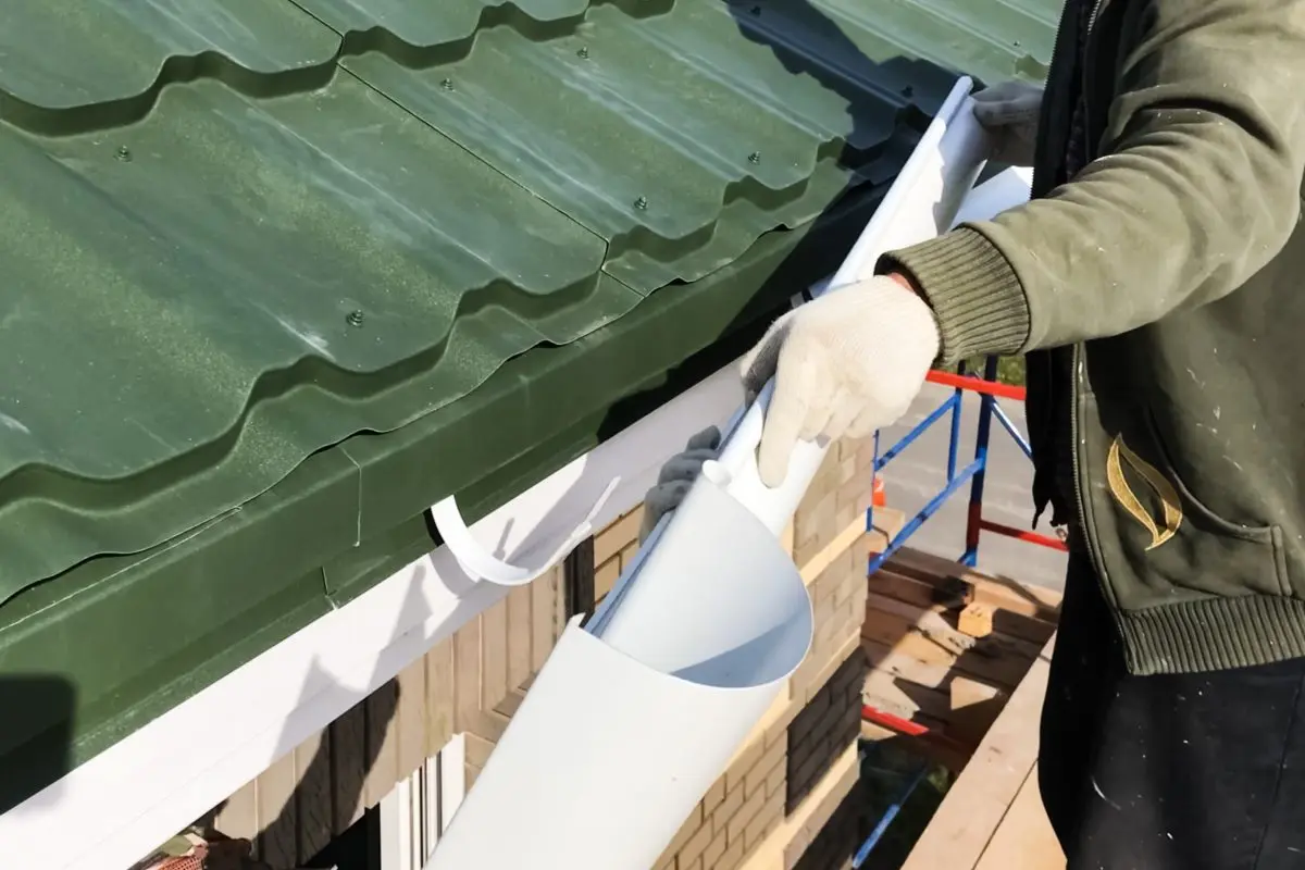 gutters mebane nc Workers work to assemble the roof and drainage system.