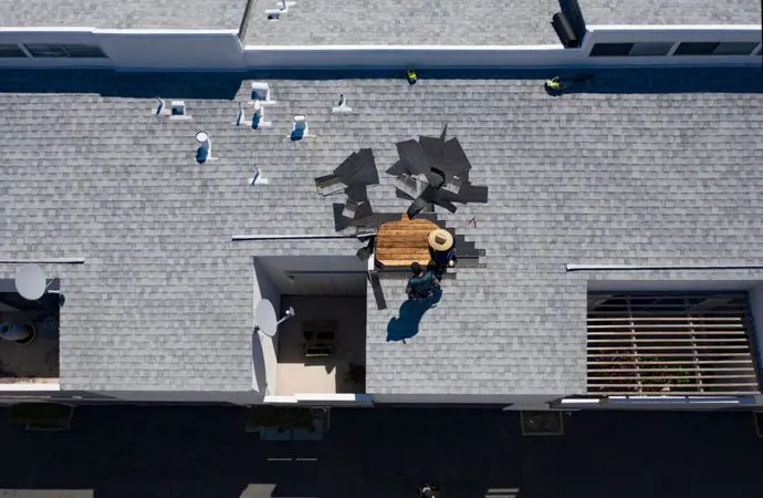 Roof Repair Inspection In Progress Aerial Above Head Condo Building Gray Shingles 2 Roofers