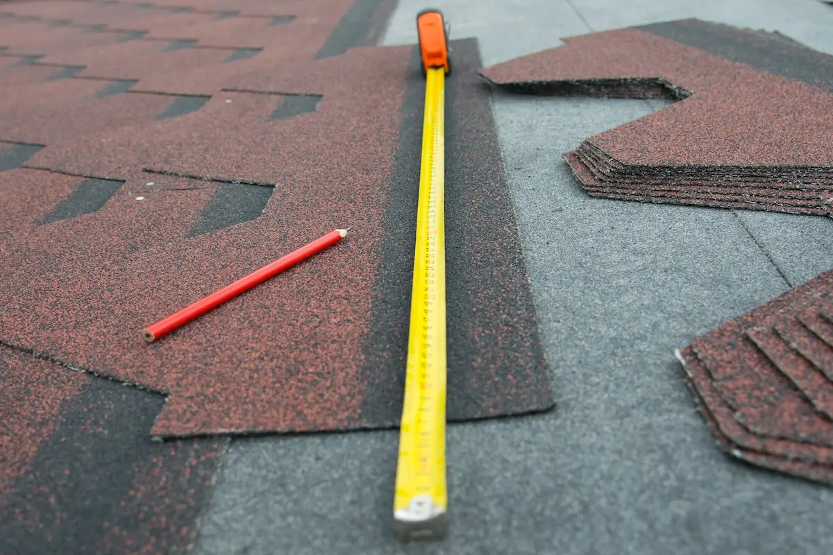close-up of a meter for measuring a soft roof for making a house roof, red pencil