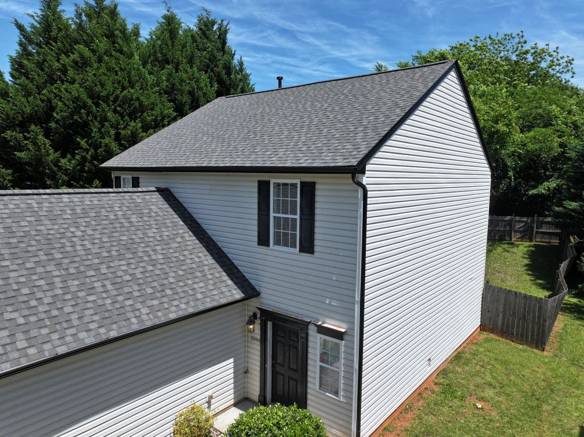 grey shingles roof and white siding