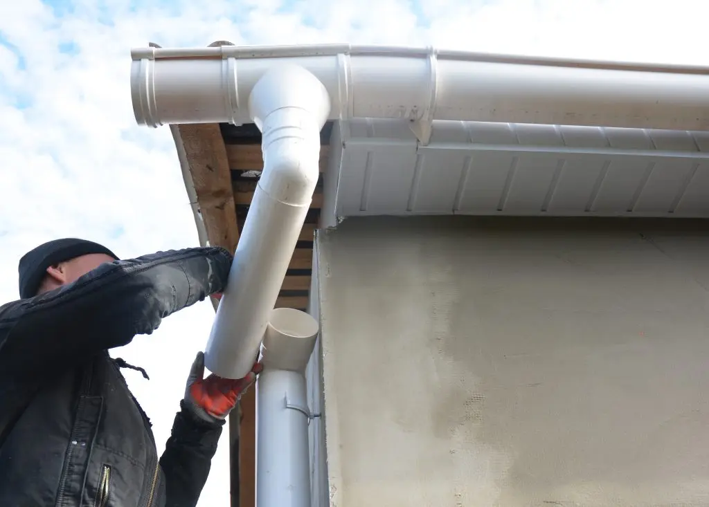 gutters raleigh nc Roofer install and repair gutter system. Rain gutter installation with drain downspout pipe. Guttering.