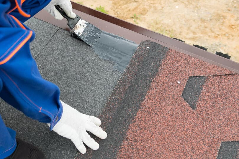 guy installing shingles 