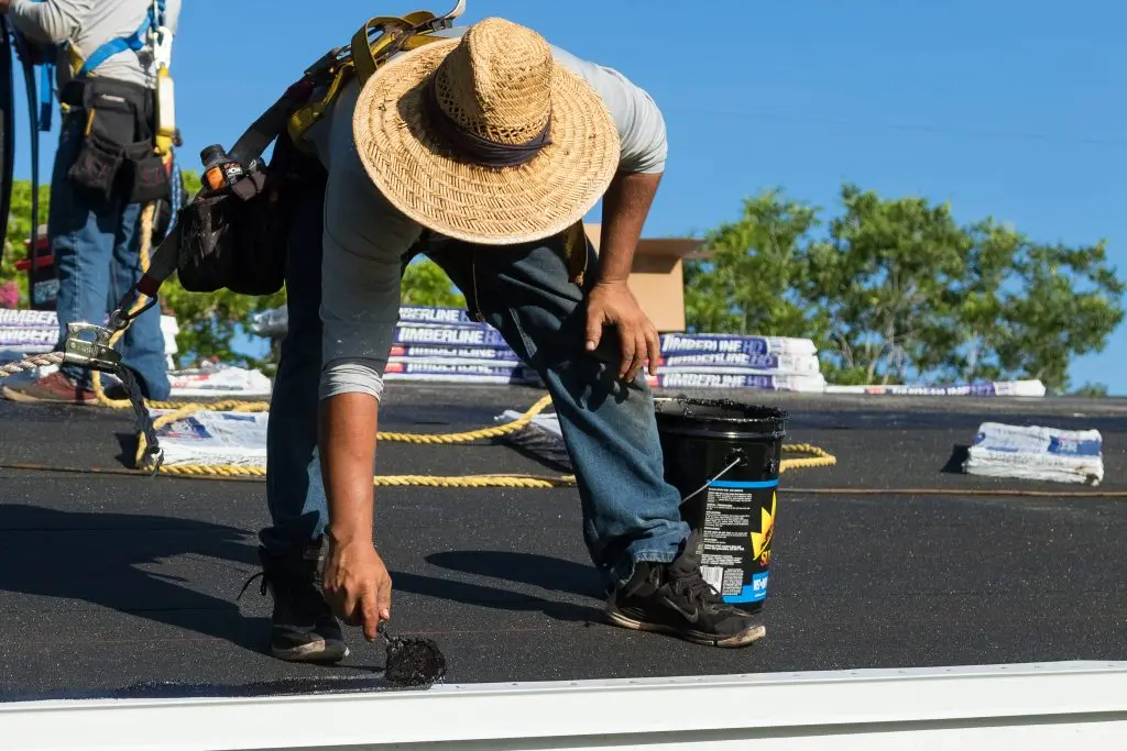 synthetic roof underlayment vs felt worker installing new roof