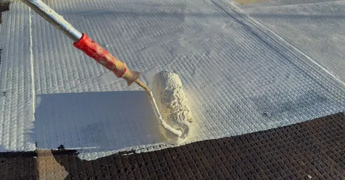 closeup of paintroller with resin