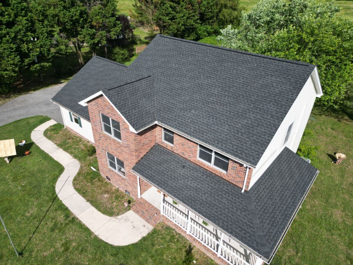 Dark grey roof on a brick house