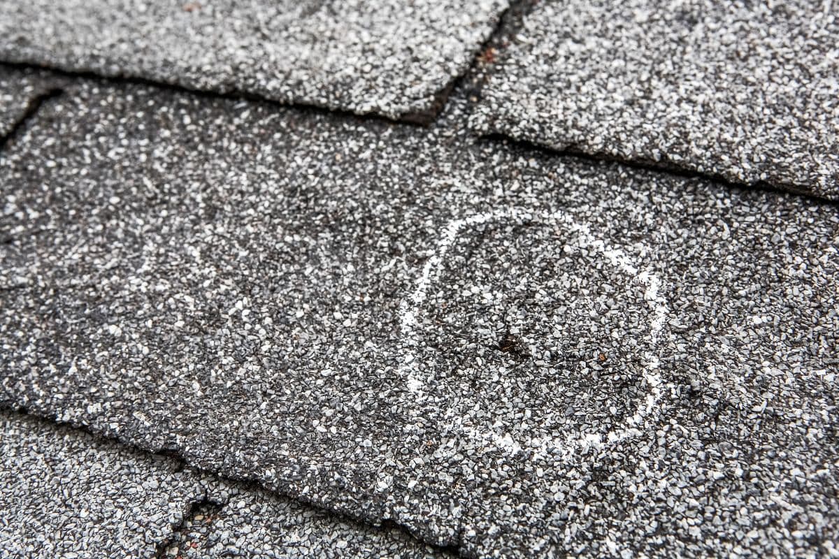 close-up view of shingle damage after hail storm