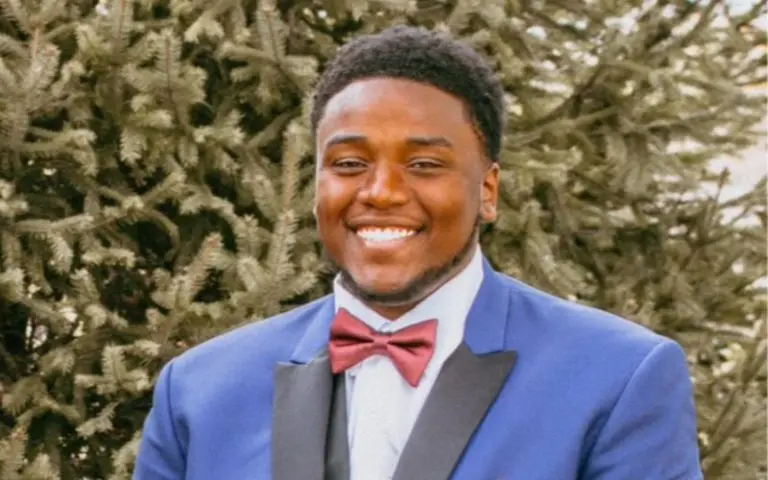 Montez Miles, College HUNKS franchise owner for Indianapolis, Indiana, smiling in a blue suit jacket and bow tie