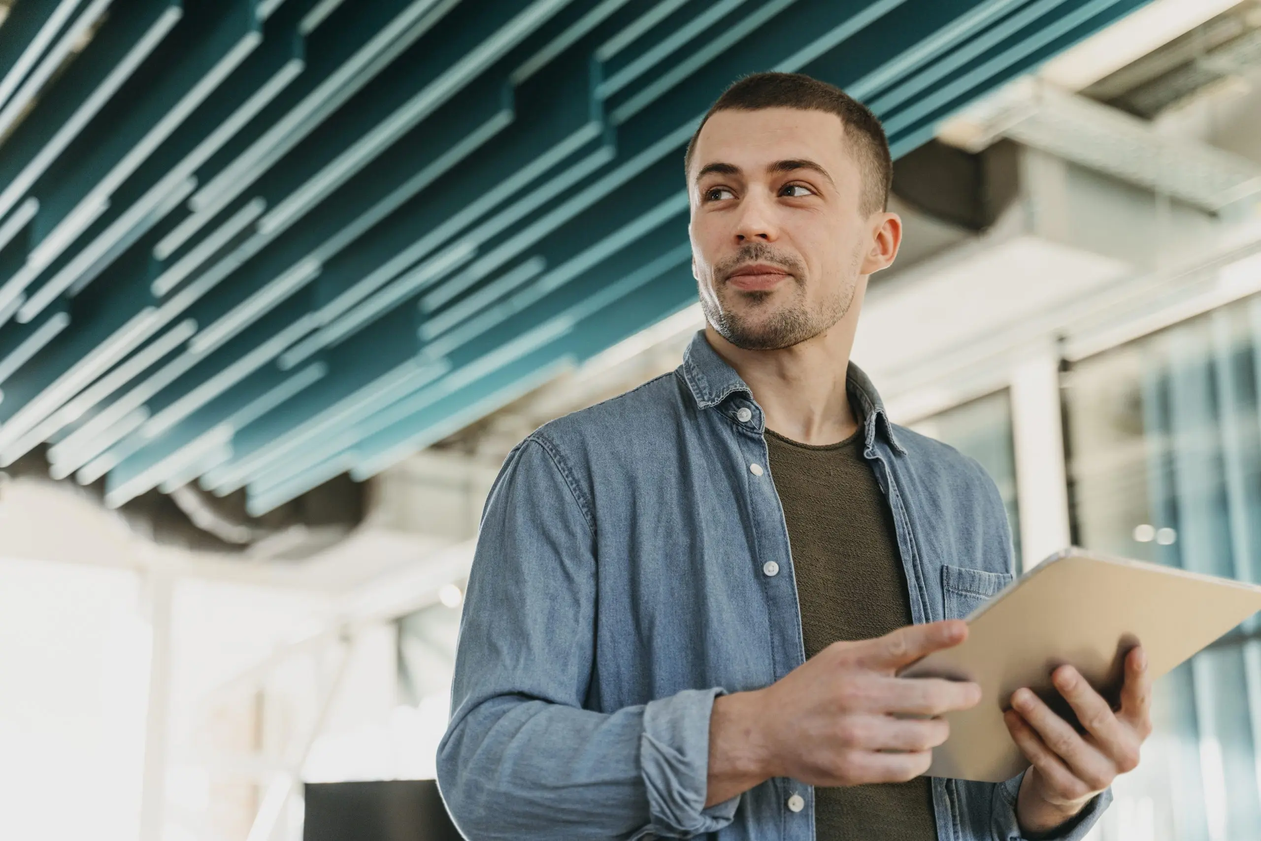 Franchise owner reviewing the day on a tablet, weighing franchise owner responsibilities before signing an agreement