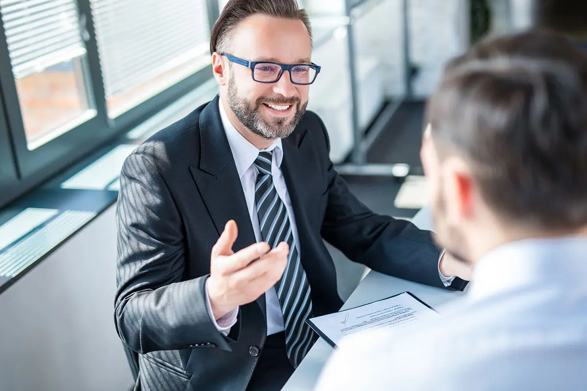 Business people negotiating a contract