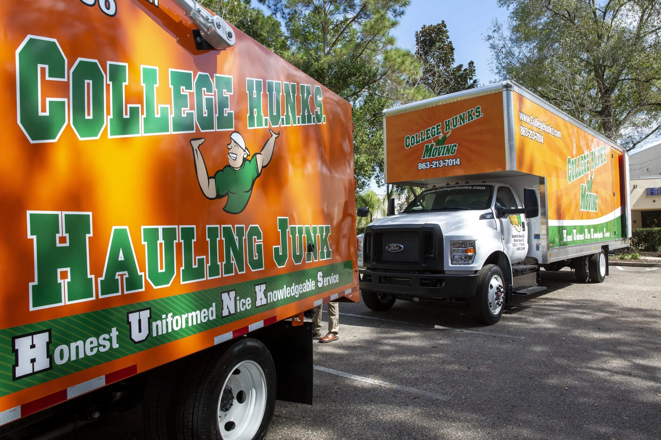 College Hunks Hauling Junk and College Hunks Moving trucks parked together